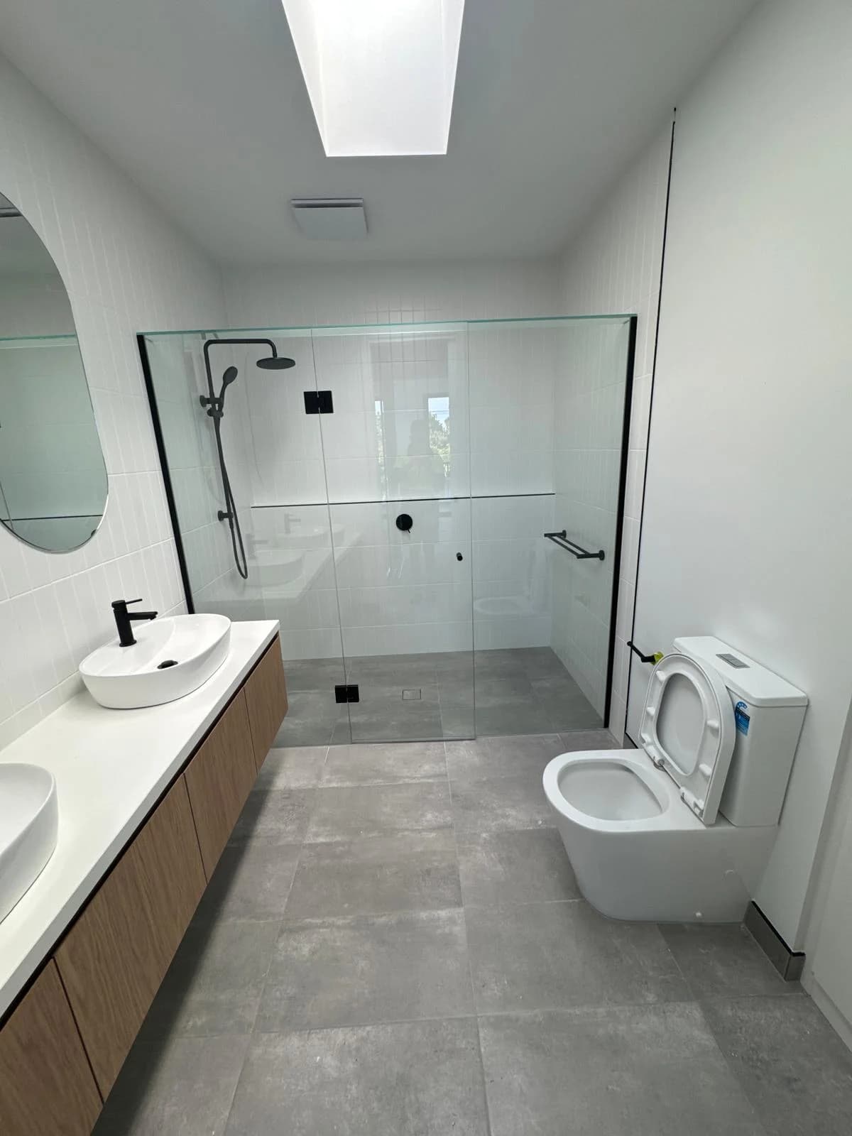 SJ Tiles & Stones team working on a Melbourne tiling project